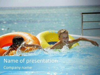 A Boy And A Girl Playing In A Swimming Pool PowerPoint Template