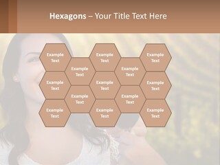 A Woman Holding A Glass Of Wine In Front Of A Vineyard PowerPoint Template