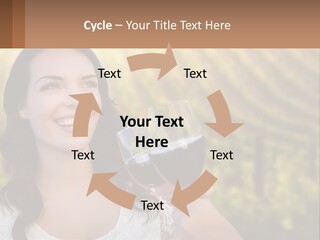 A Woman Holding A Glass Of Wine In Front Of A Vineyard PowerPoint Template