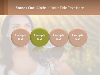A Woman Holding A Glass Of Wine In Front Of A Vineyard PowerPoint Template