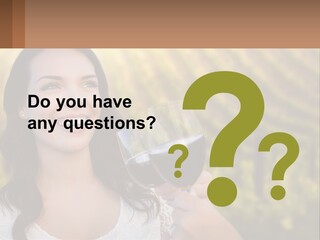 A Woman Holding A Glass Of Wine In Front Of A Vineyard PowerPoint Template