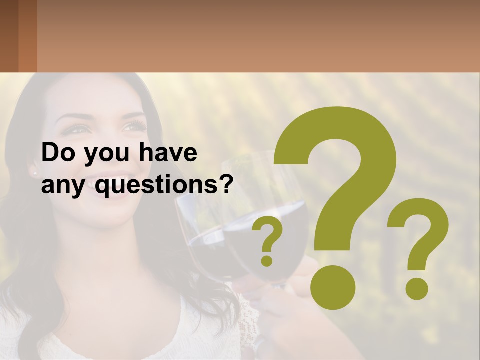 A Woman Holding A Glass Of Wine In Front Of A Vineyard PowerPoint Template