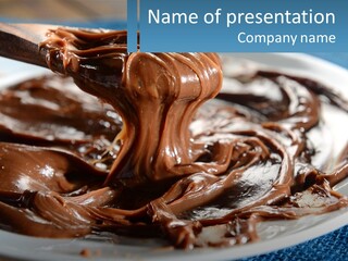 A Plate Of Melted Chocolate On A Table PowerPoint Template