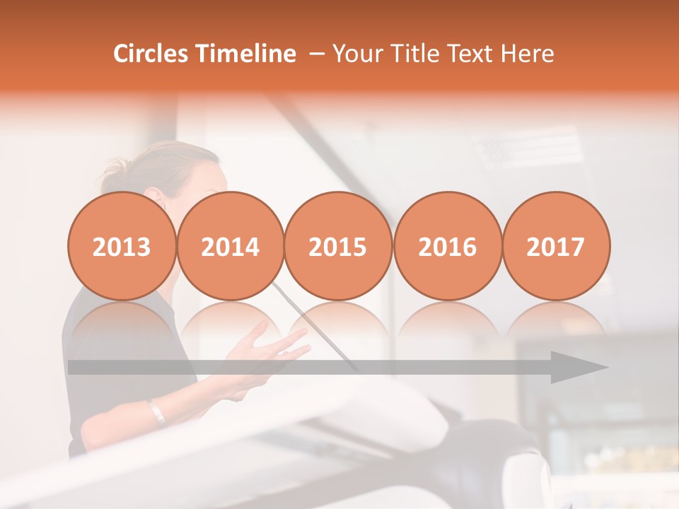 A Woman Speaking At A Podium With A Microphone PowerPoint Template