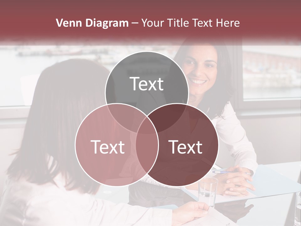 Two Women Sitting At A Table Talking To Each Other PowerPoint Template