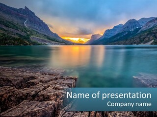 A Large Body Of Water With Mountains In The Background PowerPoint Template