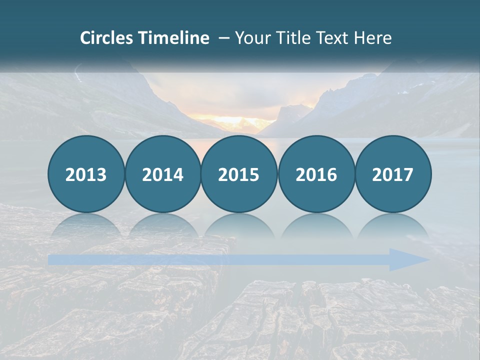 A Large Body Of Water With Mountains In The Background PowerPoint Template