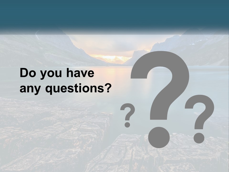 A Large Body Of Water With Mountains In The Background PowerPoint Template