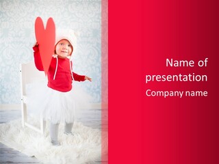 A Little Girl In A Red Sweater Holding A Heart PowerPoint Template
