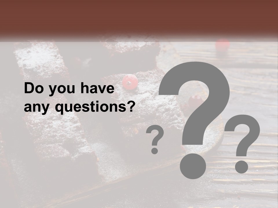 A Plate Of Brownies With Cherries On A Wooden Table PowerPoint Template