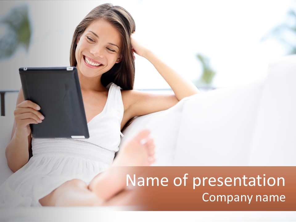 A Woman Sitting On A Couch Holding A Tablet PowerPoint Template