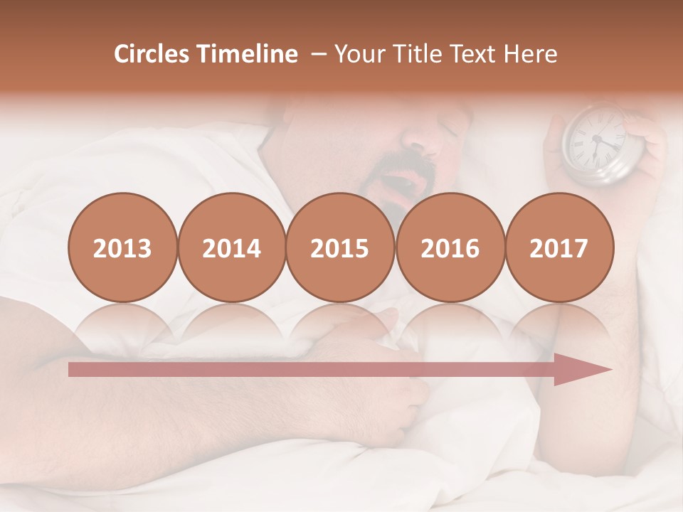 A Man Sleeping In Bed With A Clock In His Hand PowerPoint Template