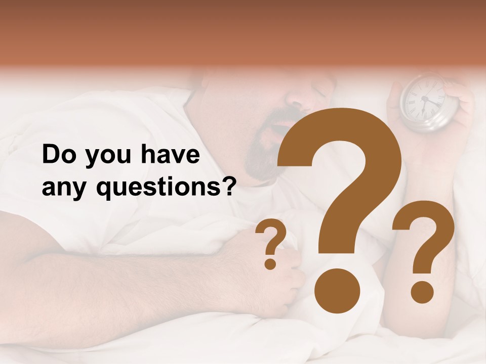 A Man Sleeping In Bed With A Clock In His Hand PowerPoint Template