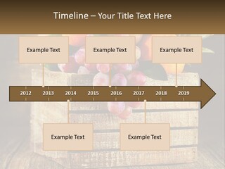 A Wooden Crate Filled With Fruit On Top Of A Wooden Table PowerPoint Template