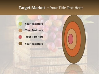 A Wooden Crate Filled With Fruit On Top Of A Wooden Table PowerPoint Template