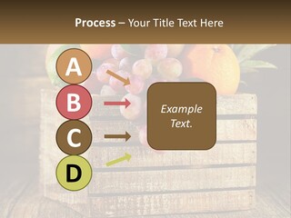 A Wooden Crate Filled With Fruit On Top Of A Wooden Table PowerPoint Template