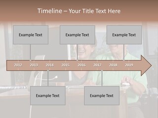 A Man And A Woman Sitting In Front Of A Computer PowerPoint Template