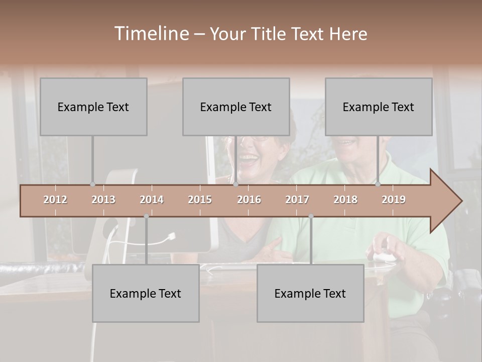 A Man And A Woman Sitting In Front Of A Computer PowerPoint Template