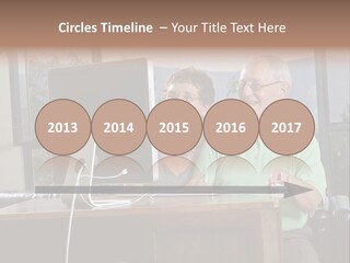 A Man And A Woman Sitting In Front Of A Computer PowerPoint Template