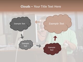 A Man And A Woman Sitting In Front Of A Computer PowerPoint Template
