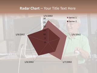 A Man And A Woman Sitting In Front Of A Computer PowerPoint Template