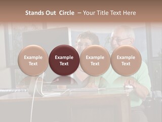 A Man And A Woman Sitting In Front Of A Computer PowerPoint Template