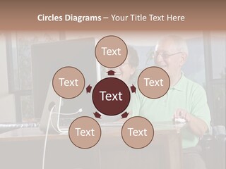 A Man And A Woman Sitting In Front Of A Computer PowerPoint Template