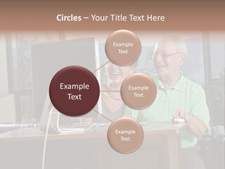 A Man And A Woman Sitting In Front Of A Computer PowerPoint Template