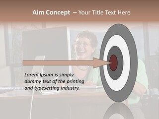 A Man And A Woman Sitting In Front Of A Computer PowerPoint Template