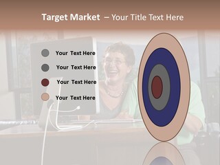 A Man And A Woman Sitting In Front Of A Computer PowerPoint Template