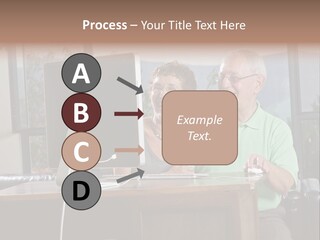 A Man And A Woman Sitting In Front Of A Computer PowerPoint Template