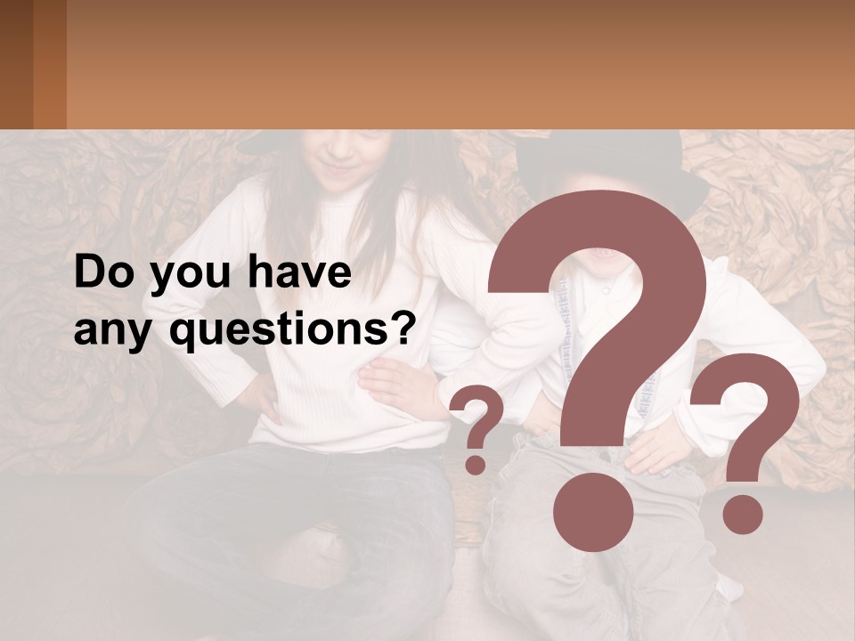 Two Young Girls Sitting On A Couch With Hats On Their Heads PowerPoint Template