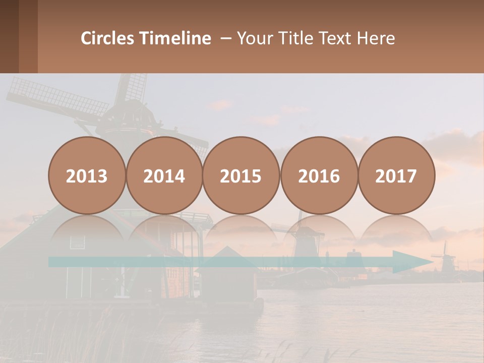 A Group Of Windmills Sitting Next To A Body Of Water PowerPoint Template