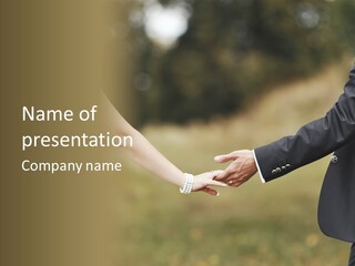 A Man And A Woman Holding Hands In A Field PowerPoint Template