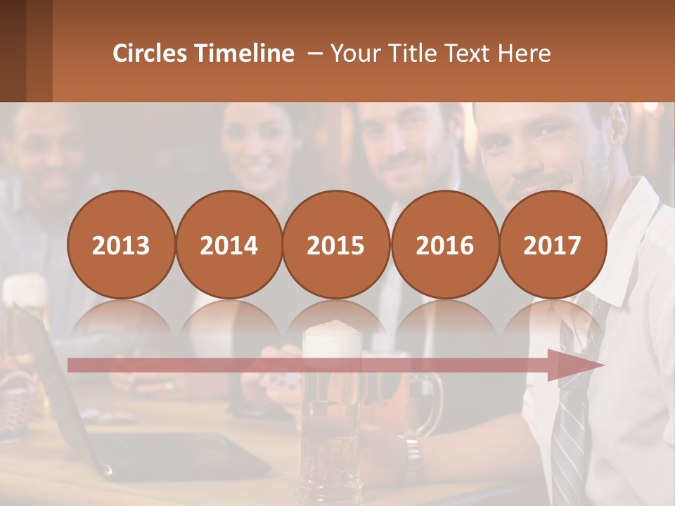A Group Of People Sitting At A Table With Beer PowerPoint Template