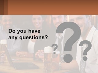 A Group Of People Sitting At A Table With Beer PowerPoint Template