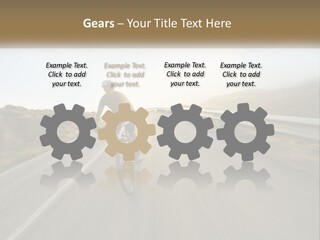 A Man Riding A Bike Down A Road PowerPoint Template