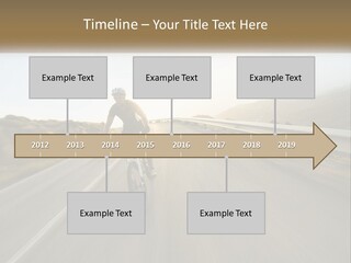 A Man Riding A Bike Down A Road PowerPoint Template