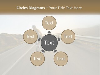 A Man Riding A Bike Down A Road PowerPoint Template