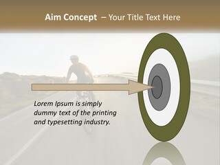 A Man Riding A Bike Down A Road PowerPoint Template