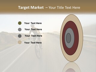 A Man Riding A Bike Down A Road PowerPoint Template