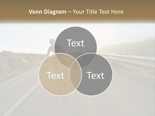 A Man Riding A Bike Down A Road PowerPoint Template