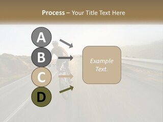 A Man Riding A Bike Down A Road PowerPoint Template