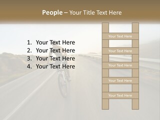 A Man Riding A Bike Down A Road PowerPoint Template