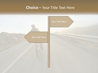 A Man Riding A Bike Down A Road PowerPoint Template
