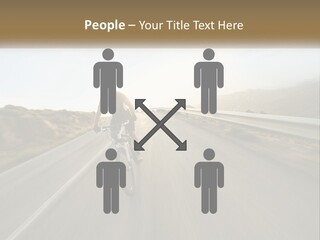 A Man Riding A Bike Down A Road PowerPoint Template