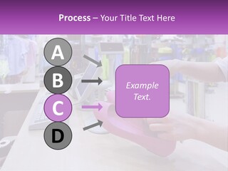 A Person Holding A Pink Object In Front Of A Computer PowerPoint Template