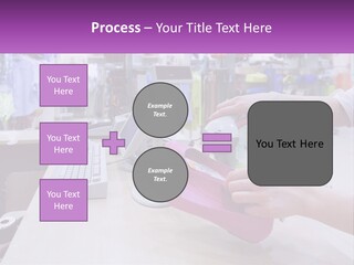 A Person Holding A Pink Object In Front Of A Computer PowerPoint Template