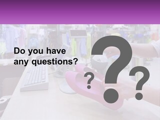 A Person Holding A Pink Object In Front Of A Computer PowerPoint Template