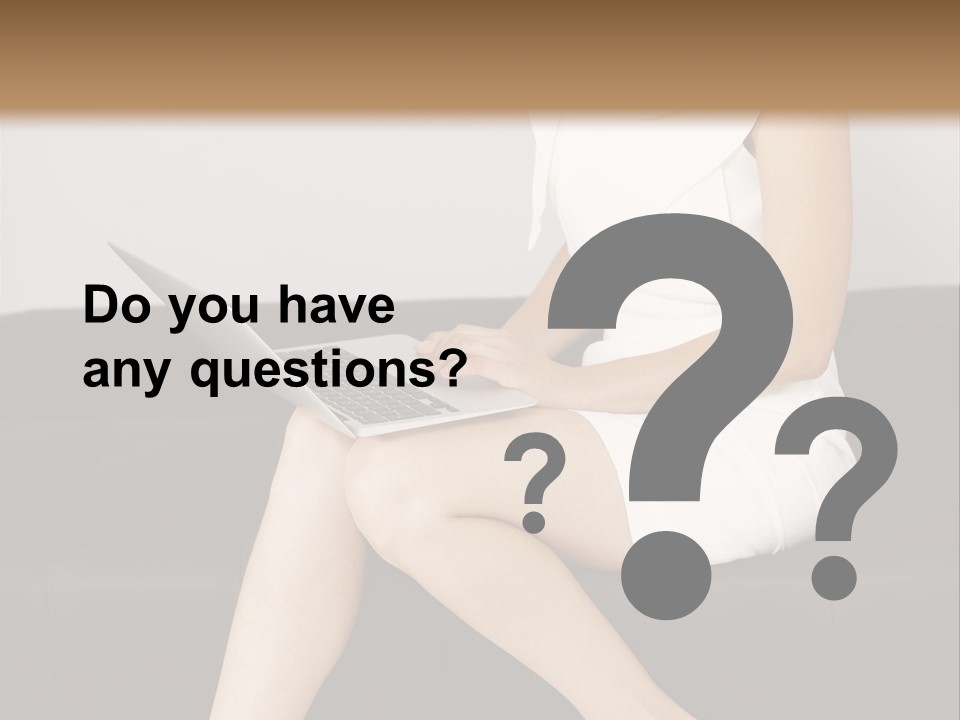 A Woman Sitting On A Couch Using A Laptop Computer PowerPoint Template